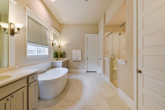 2176 Rope Maker Rd, Conroe, TX 77384 - bathroom with a shower stall, a freestanding bath, two vanities, and marble look tile flooring