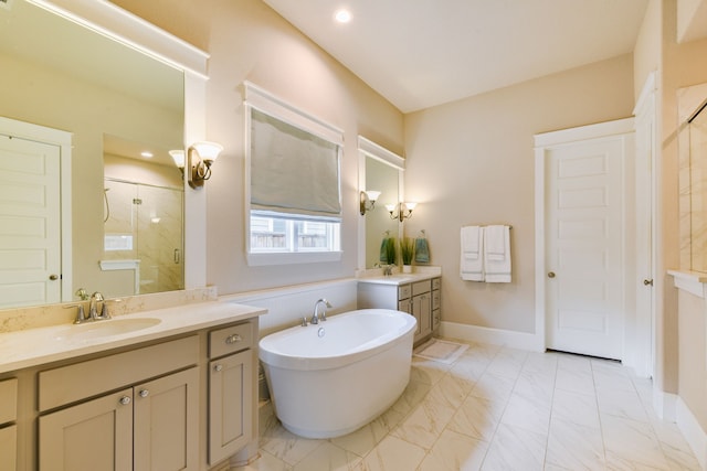 2176 Rope Maker Rd, Conroe, TX 77384 - bathroom featuring a shower stall, marble finish floors, a freestanding tub, two vanities, and recessed lighting