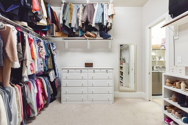 2176 Rope Maker Rd, Conroe, TX 77384 - spacious closet with washer / clothes dryer and carpet