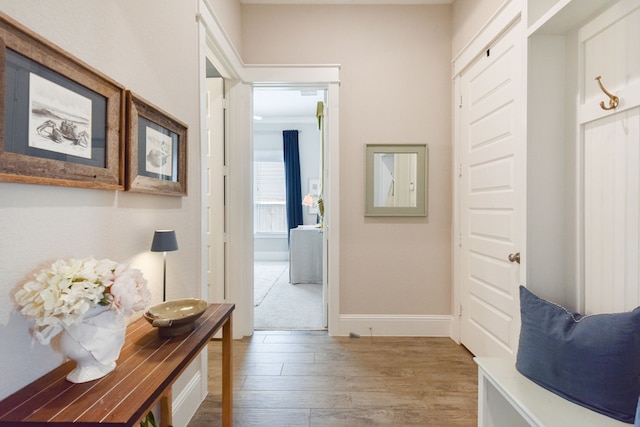 2176 Rope Maker Rd, Conroe, TX 77384 - mudroom with light wood finished floors and baseboards