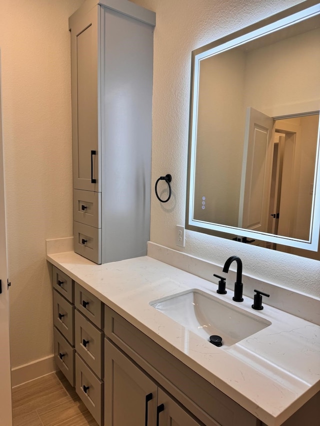 2708 Nagle St, Houston, TX 77004 - bathroom with vanity, wood finished floors, and baseboards