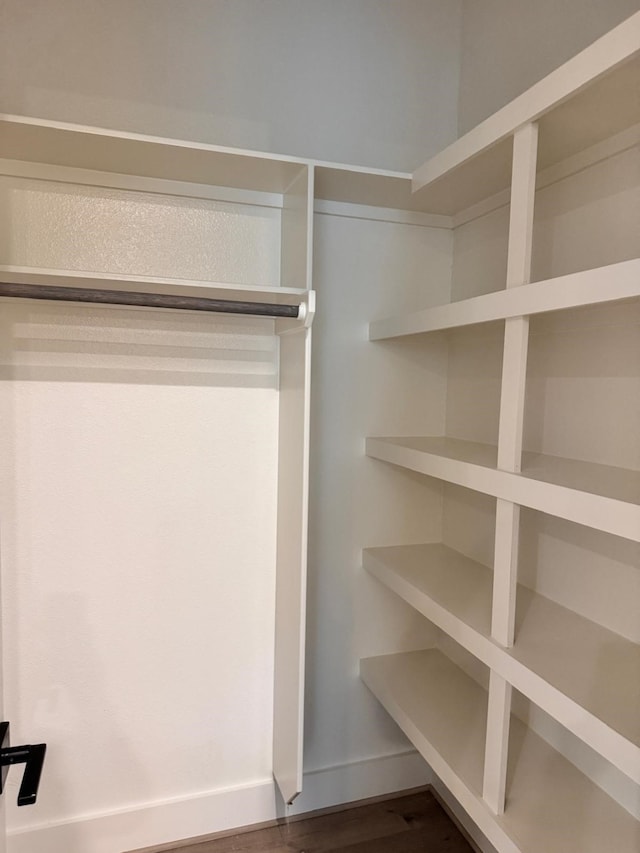 2708 Nagle St, Houston, TX 77004 - walk in closet with dark wood-type flooring