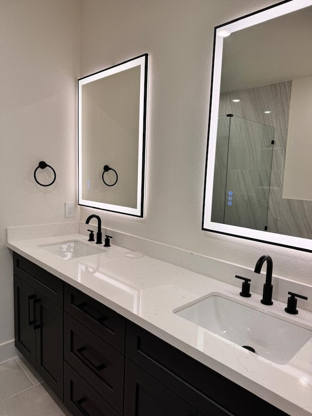 2708 Nagle St, Houston, TX 77004 - bathroom with a marble finish shower and double vanity