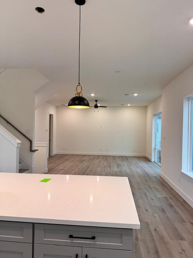 2708 Nagle St, Houston, TX 77004 - kitchen featuring gray cabinets, light wood-style floors, baseboards, a ceiling fan, and recessed lighting