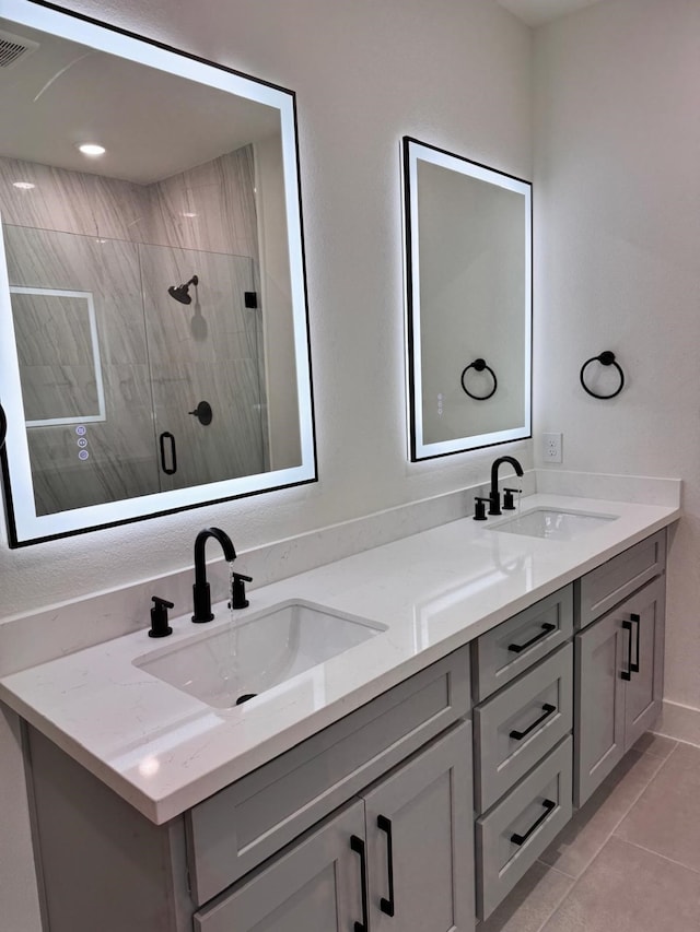 2708 Nagle St, Houston, TX 77004 - bathroom featuring double vanity, a stall shower, and tile patterned floors