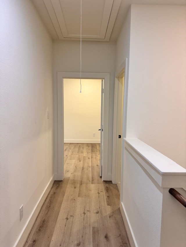 2708 Nagle St, Houston, TX 77004 - corridor with attic access, light wood-style flooring, and baseboards