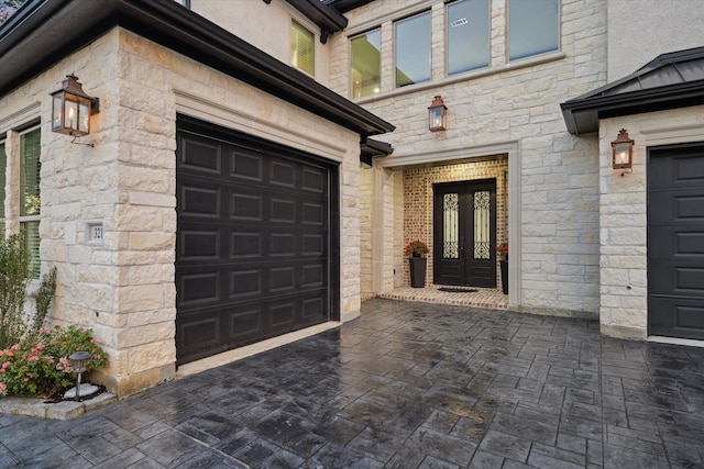 321 Waterford Way, Montgomery, TX 77356 - view of exterior entry with french doors and stone siding
