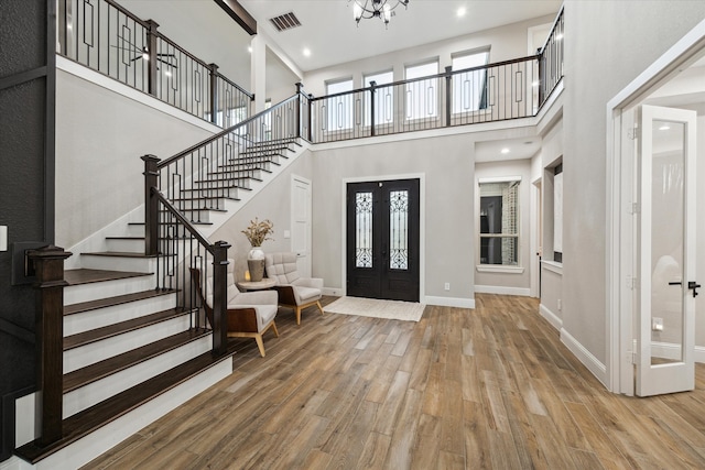 321 Waterford Way, Montgomery, TX 77356 - entryway with a high ceiling, wood finished floors, stairs, french doors, and baseboards