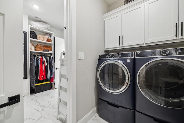 321 Waterford Way, Montgomery, TX 77356 - laundry room featuring light marble finish floors, washer and clothes dryer, cabinet space, and baseboards