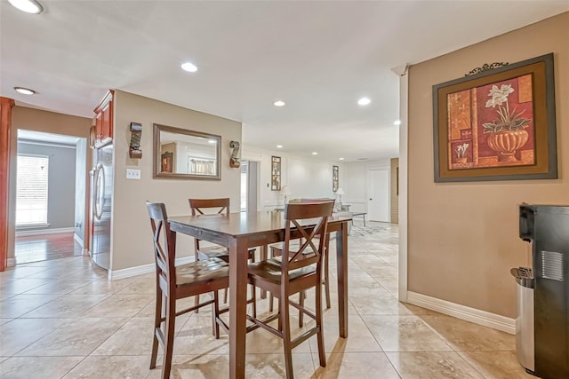 711 Lodgehill Ln, Houston, TX 77090 - dining space with baseboards, recessed lighting, and light tile patterned flooring