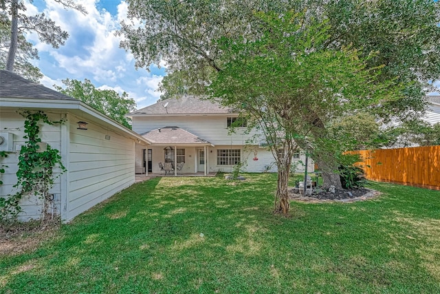 711 Lodgehill Ln, Houston, TX 77090 - rear view of property with a patio area and roof with shingles