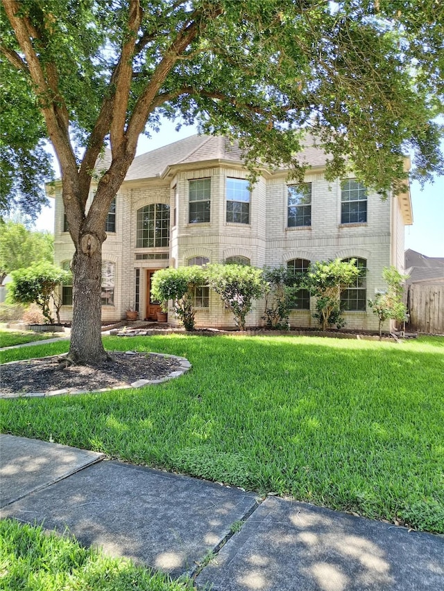5014 Misty Park Ln, Sugar Land, TX 77479 - view of front of house featuring a front yard and brick siding