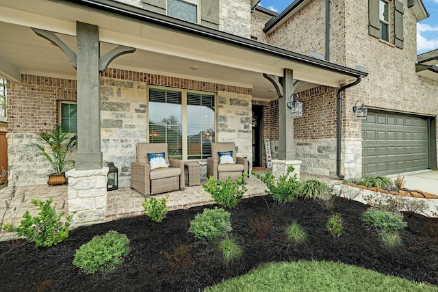 12531 Tullich Run Dr, Humble, TX 77346 - entrance to property featuring a porch, a garage, driveway, brick siding, and stone siding