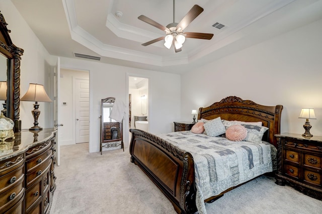 12531 Tullich Run Dr, Humble, TX 77346 - bedroom featuring light colored carpet, a raised ceiling, a ceiling fan, connected bathroom, and crown molding