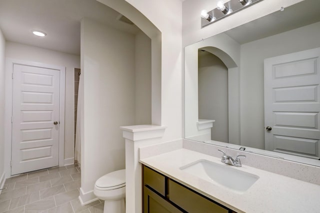 12531 Tullich Run Dr, Humble, TX 77346 - bathroom featuring vanity, toilet, a shower with shower curtain, baseboards, and tile patterned flooring