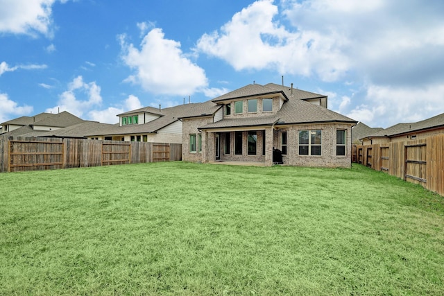 12531 Tullich Run Dr, Humble, TX 77346 - rear view of house with brick siding and roof with shingles