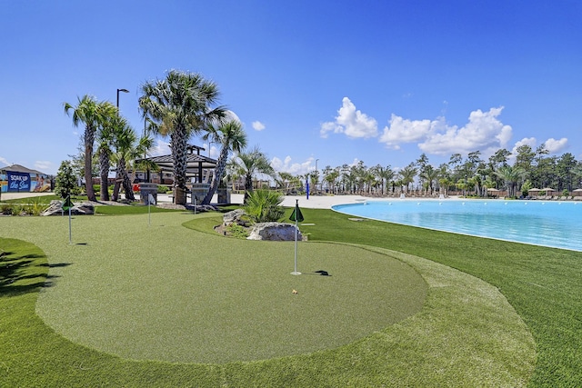 12531 Tullich Run Dr, Humble, TX 77346 - surrounding community featuring an area to practice putting, a swimming pool, and a yard