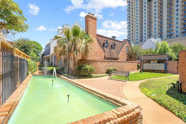5380 Brownway St Unit D38, Houston, TX 77056 - view of property's community with a putting green and fence