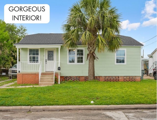 5528 Menard Ave, Galveston, TX 77551 - bungalow-style house featuring crawl space, a front lawn, covered porch, and roof with shingles