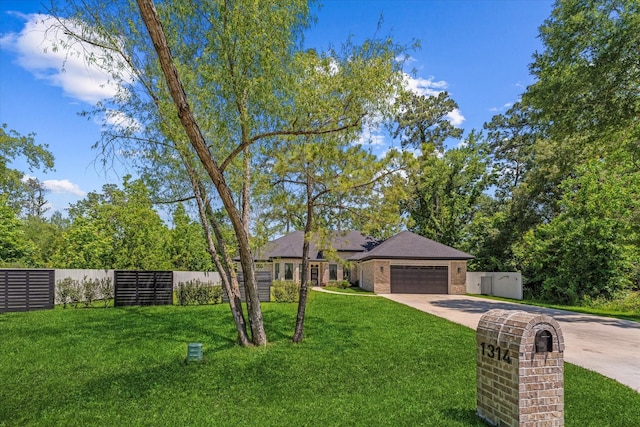 1314 Briar Cliff St, Conroe, TX 77385 - view of front of house featuring driveway and an attached garage
