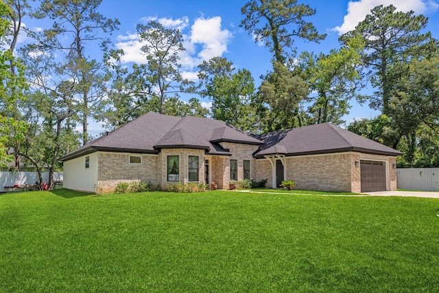 1314 Briar Cliff St, Conroe, TX 77385 - french country home with brick siding, driveway, a garage, and a shingled roof