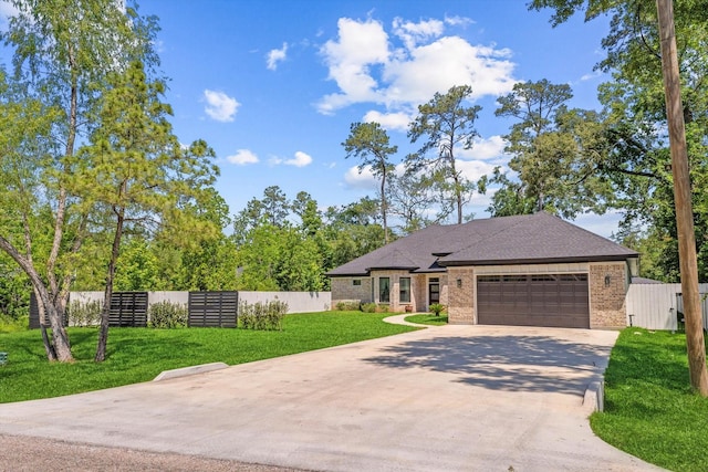 1314 Briar Cliff St, Conroe, TX 77385 - view of front of property with brick siding, an attached garage, and concrete driveway