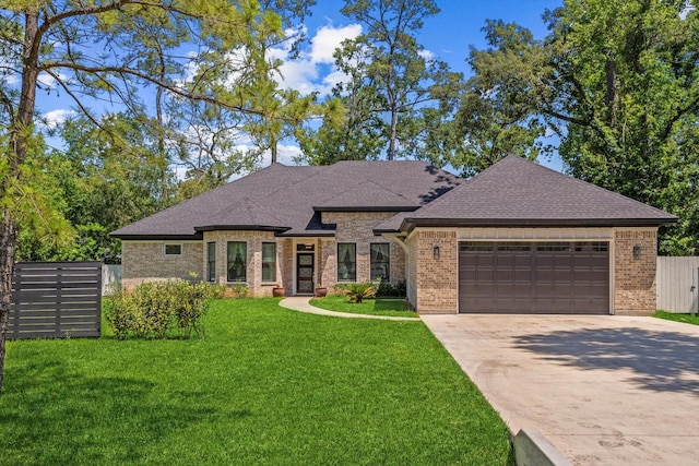 1314 Briar Cliff St, Conroe, TX 77385 - french country inspired facade featuring brick siding, an attached garage, a shingled roof, and driveway