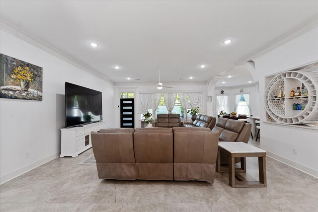 1314 Briar Cliff St, Conroe, TX 77385 - living room featuring crown molding, healthy amount of natural light, recessed lighting, ceiling fan, and baseboards