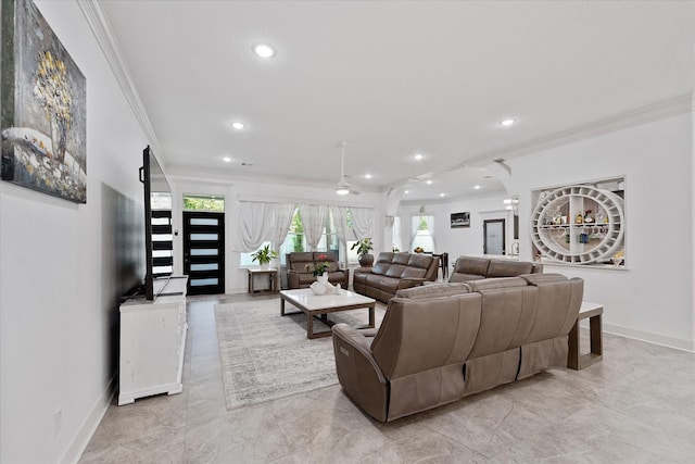 1314 Briar Cliff St, Conroe, TX 77385 - living room with crown molding, light marble finish floors, healthy amount of natural light, baseboards, and recessed lighting