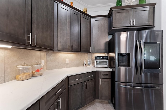 1314 Briar Cliff St, Conroe, TX 77385 - kitchen featuring stainless steel fridge, dark brown cabinets, decorative backsplash, and crown molding