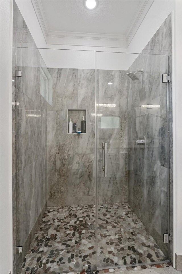 1314 Briar Cliff St, Conroe, TX 77385 - bathroom featuring crown molding and a marble finish shower