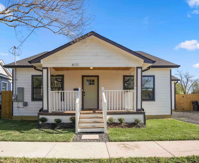 4111 Engelke St, Houston, TX 77003 - bungalow-style house featuring covered porch and roof with shingles