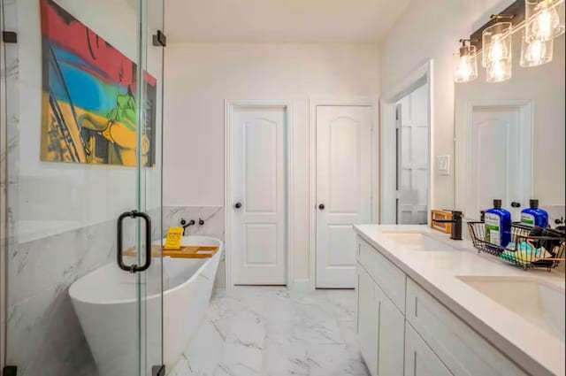 4111 Engelke St, Houston, TX 77003 - full bathroom featuring marble look tile flooring, a freestanding tub, double vanity, and a shower stall