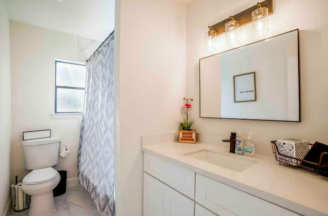 4111 Engelke St, Houston, TX 77003 - bathroom with marble finish floors, toilet, vanity, and a shower with shower curtain