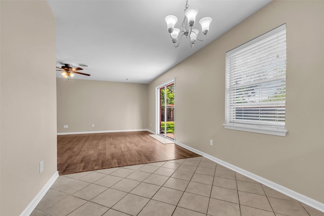 5839 Ettrick Dr, Houston, TX 77035 - empty room featuring baseboards, light wood-type flooring, a ceiling fan, and a chandelier
