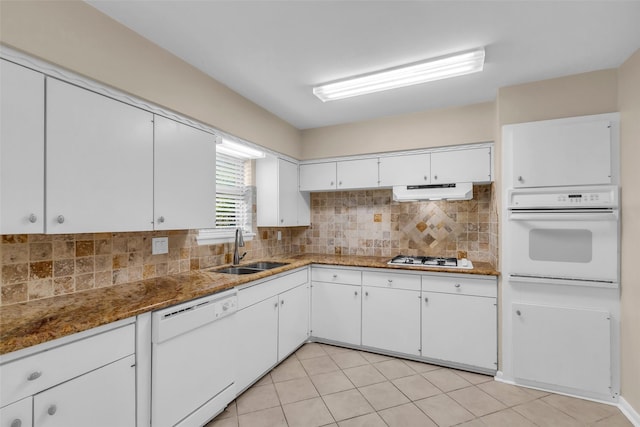 5839 Ettrick Dr, Houston, TX 77035 - kitchen featuring white appliances, a sink, white cabinetry, backsplash, and under cabinet range hood