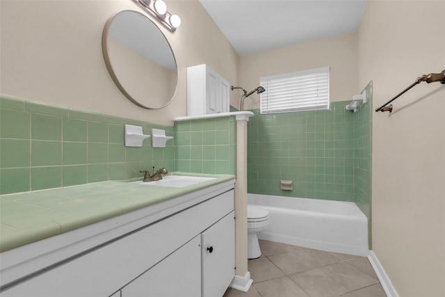 5839 Ettrick Dr, Houston, TX 77035 - full bathroom with tile patterned flooring, toilet, shower / bathtub combination, vanity, and tile walls