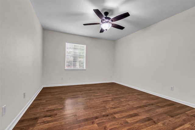 5839 Ettrick Dr, Houston, TX 77035 - unfurnished room with dark wood-type flooring, ceiling fan, and baseboards