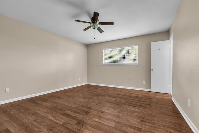 5839 Ettrick Dr, Houston, TX 77035 - unfurnished room featuring dark wood-type flooring, a ceiling fan, and baseboards