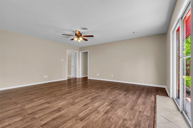 5839 Ettrick Dr, Houston, TX 77035 - unfurnished room featuring wood finished floors, a ceiling fan, and baseboards