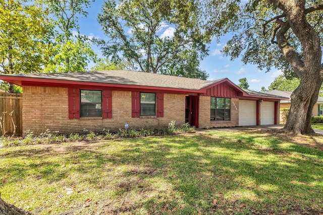 5839 Ettrick Dr, Houston, TX 77035 - view of front facade with brick siding, a garage, concrete driveway, and board and batten siding