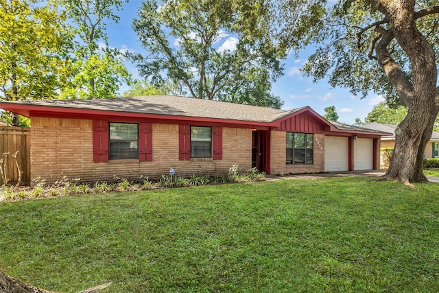 5839 Ettrick Dr, Houston, TX 77035 - view of front of property featuring brick siding, a garage, driveway, and board and batten siding