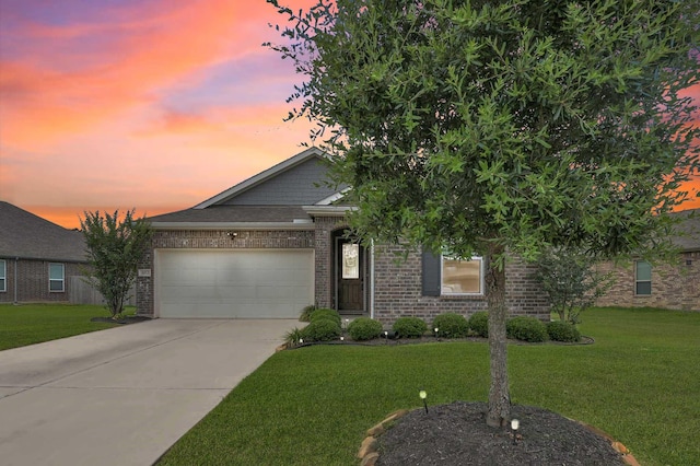 3812 Cimarron Gap Ln, Magnolia, TX 77354 - view of front of home featuring a garage, driveway, a yard, and brick siding