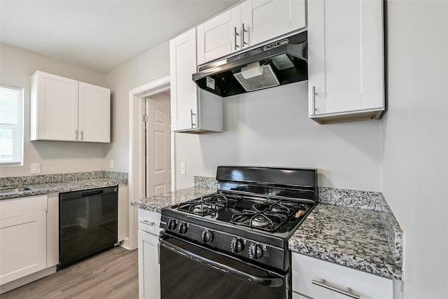 801 S Travis Ave, Cleveland, TX 77327 - kitchen featuring black appliances, under cabinet range hood, light wood-style floors, white cabinetry, and a sink