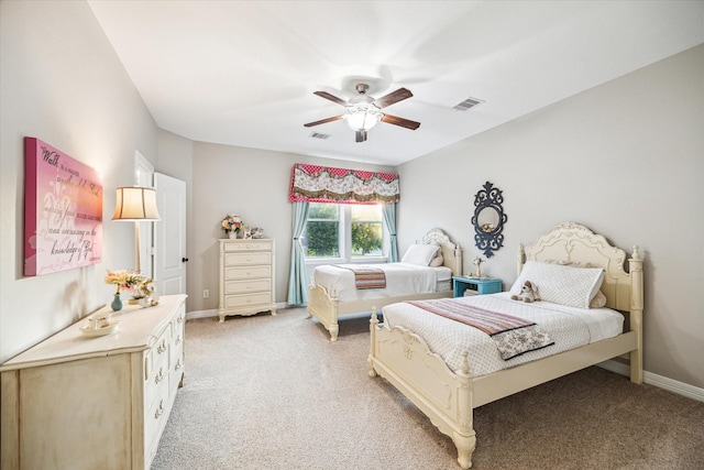 10114 Logan Grove Ct, Conroe, TX 77302 - bedroom with light colored carpet, baseboards, and ceiling fan