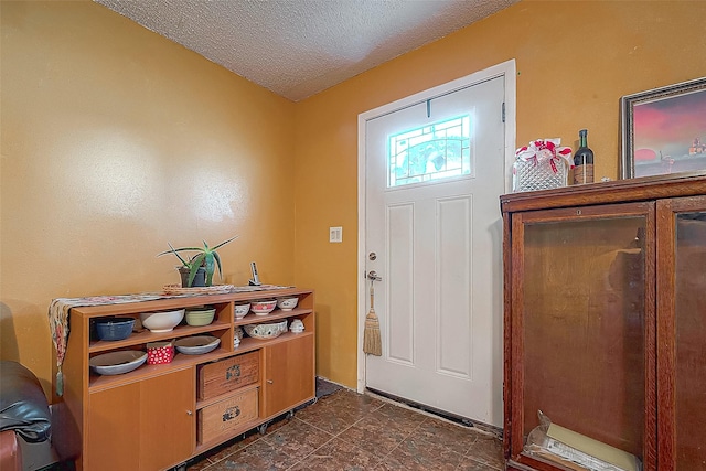 220 Hillcrest Dr, Coldspring, TX 77331 - entrance foyer with a textured ceiling