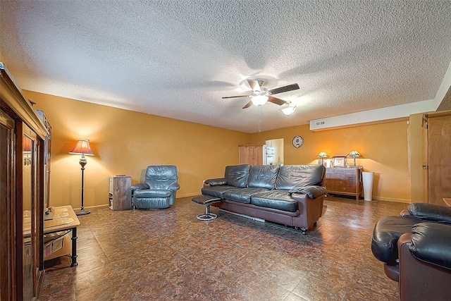 220 Hillcrest Dr, Coldspring, TX 77331 - living room featuring a ceiling fan, baseboards, and a textured ceiling