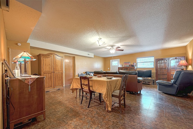 220 Hillcrest Dr, Coldspring, TX 77331 - dining space with ceiling fan and a textured ceiling