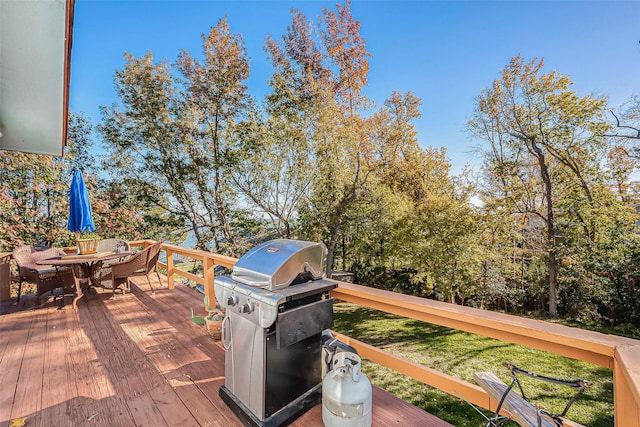 220 Hillcrest Dr, Coldspring, TX 77331 - wooden deck featuring area for grilling and outdoor dining space
