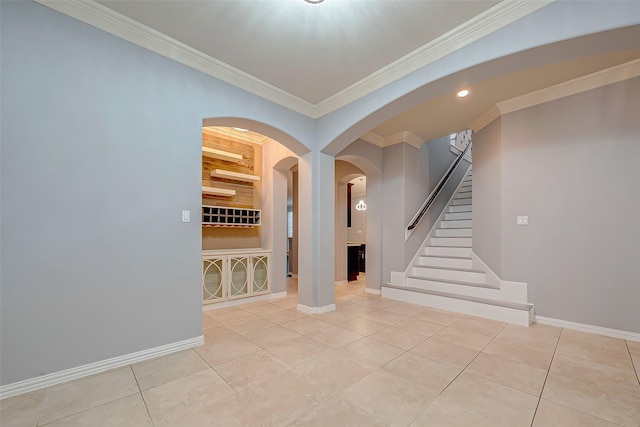 18306 S Austin Shore Dr, Cypress, TX 77433 - foyer with crown molding, light tile patterned floors, arched walkways, baseboards, and stairway